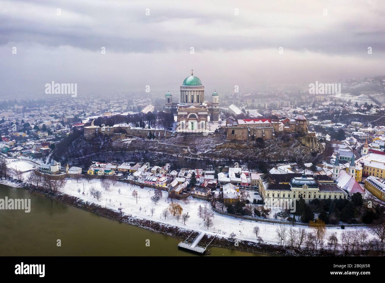 Esztergom, Hungary - Aerial skyline view of Esztergom with the beautiful snowy Basilica on a foggy winter morning Stock Photo