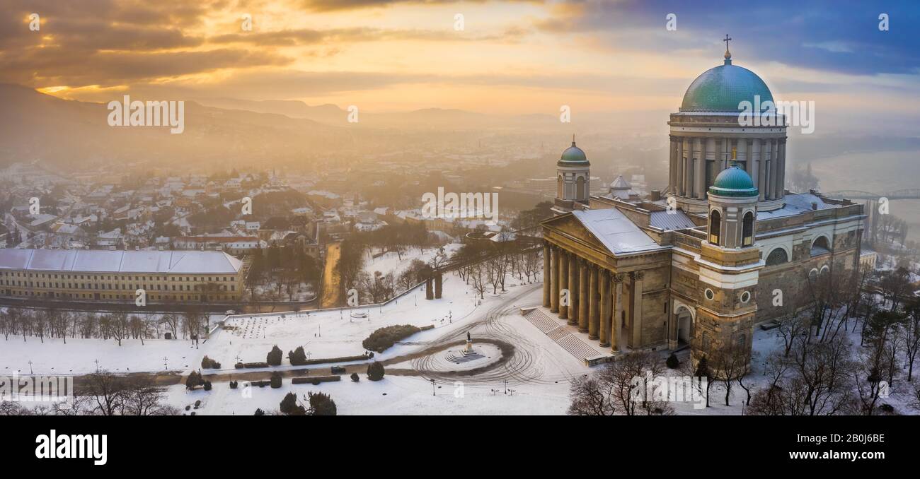 Esztergom, Hungary - Aerial panoramic view of the snowy Esztergom Basilica on a foggy winter sunrise Stock Photo