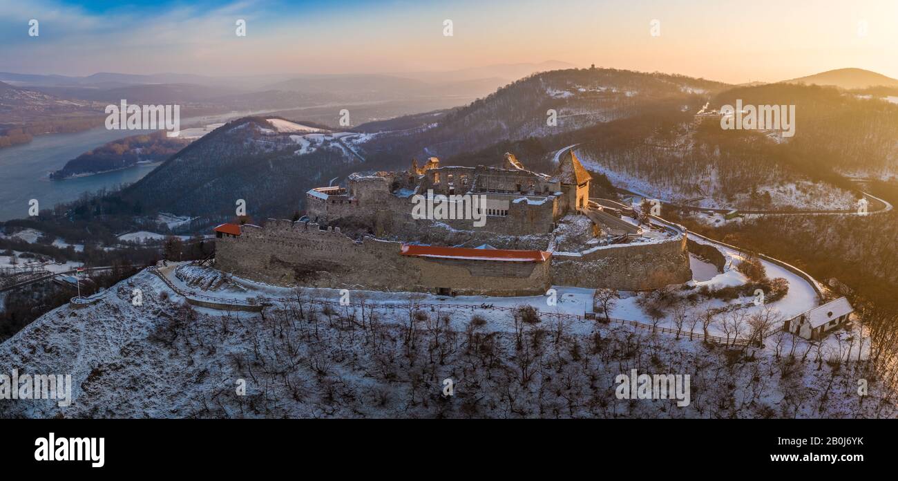 Visegrad, Hungary - Aerial panoramic view of the beautiful old and snowy high castle of Visegrad at sunrise on a winter morning Stock Photo