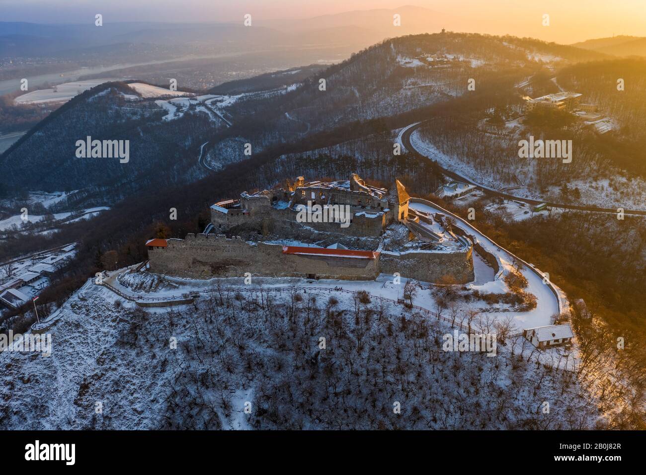 Visegrad, Hungary - Aerial view of the beautiful old and snowy high castle of Visegrad at sunrise on a winter morning Stock Photo