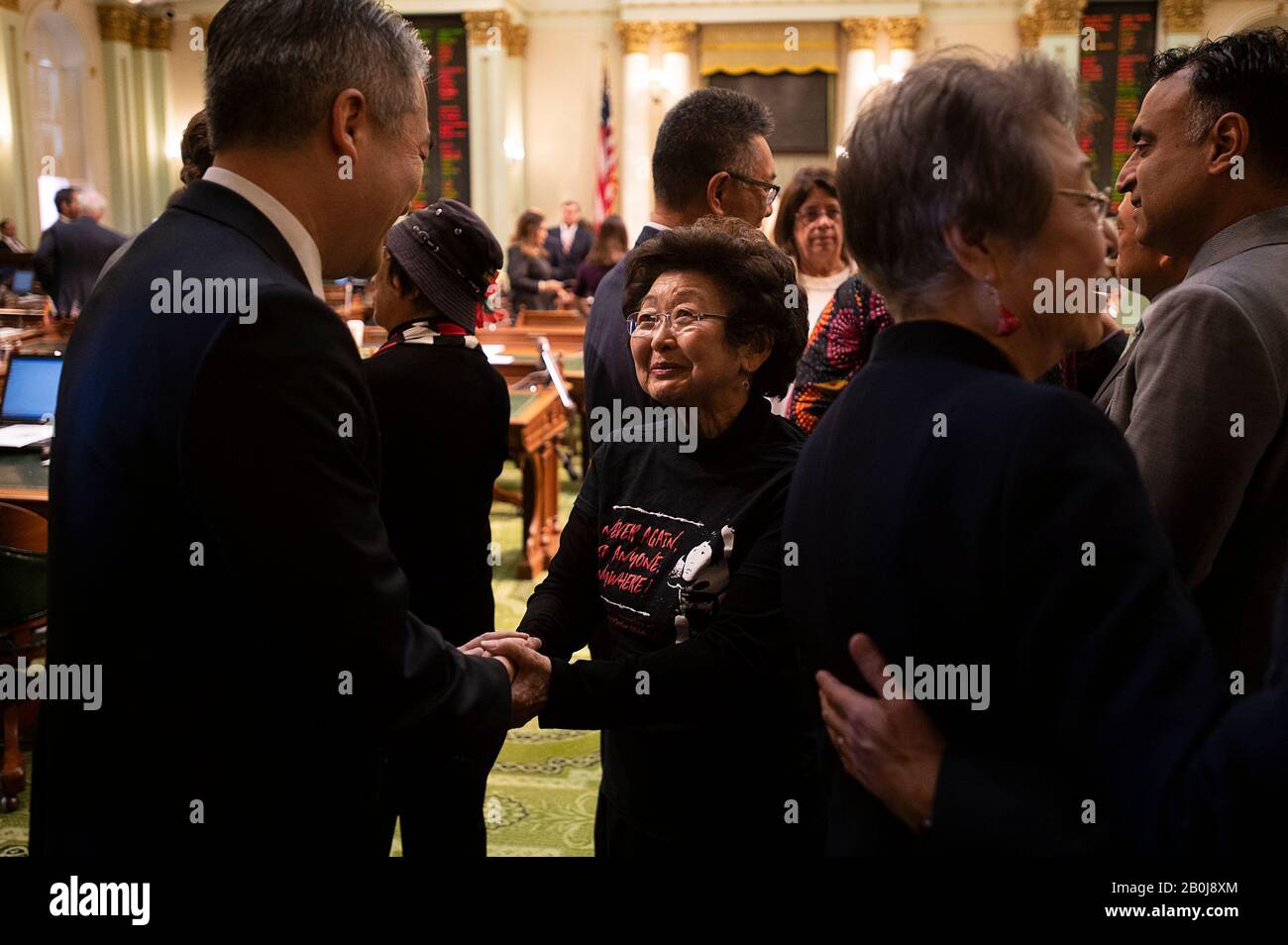 Sacramento, CA, USA. 20th Feb, 2020. Assemblyman Al Muratsuchi greets Marielee Tsukamoto in after the passing of after HR77 that spells out in excruciating detail CaliforniaÃs anti-Japanese heritage and is passed at the State Capital on Thursday, Feb 20, 2020 in Sacramento. On Feb. 19, 1942 President Franklin D. Roosevelt signed Executive Order 9066 that forcibly removed and incarcerated over 110, 00 Japanese Americans into prison camps during WWII. Credit: Paul Kitagaki Jr./ZUMA Wire/Alamy Live News Stock Photo