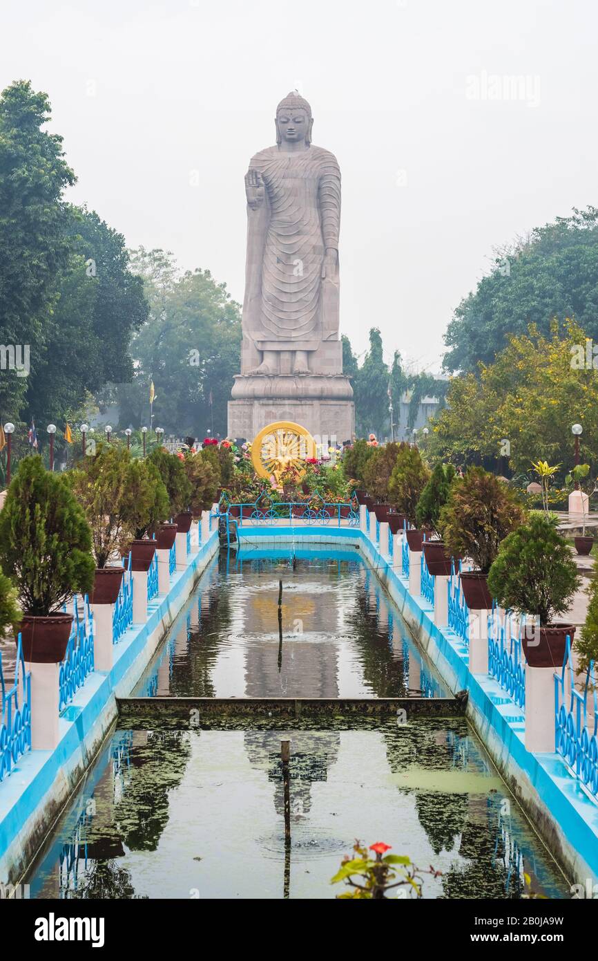 Large statue of standing Buddha in WAT THAI Temple, Sarnath city near Varanasi, India Stock Photo