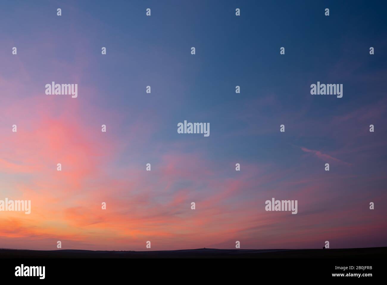 Beautiful colorful clouds after sunset on blue sky Stock Photo