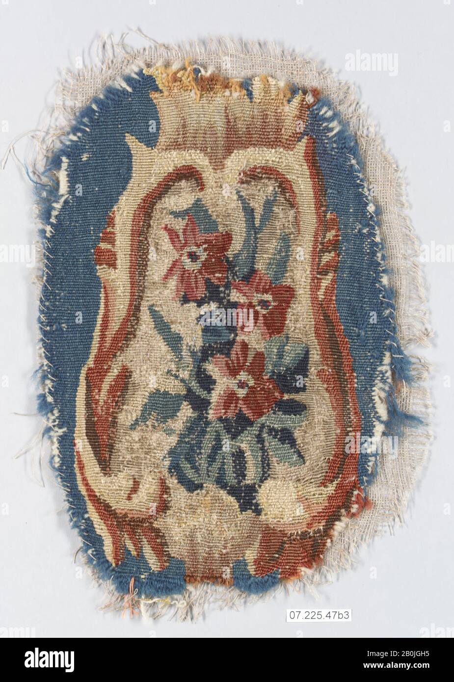 Probably manufactured in the Beauvais, Rocaille cartouche with flowers, French, probably Beauvais, ca. 1735–50, French, probably Beauvais, Wool, silk (20-22 warps per inch, 8 per cm.), 11 × 6 in. (27.9 × 15.2 cm), Textiles-Tapestries Stock Photo