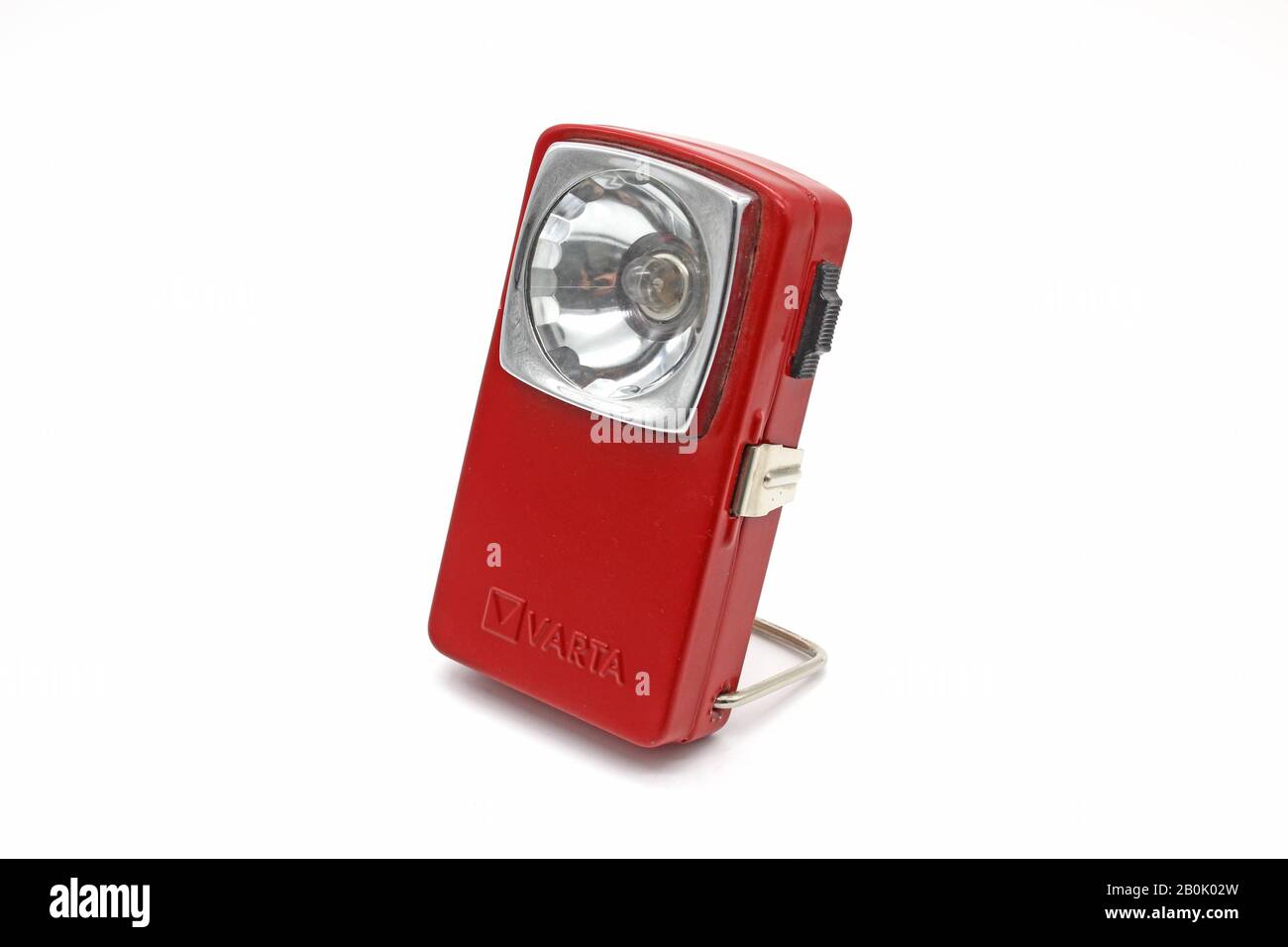 Vintage metal red flashlight torch, isolated on a white background Stock Photo