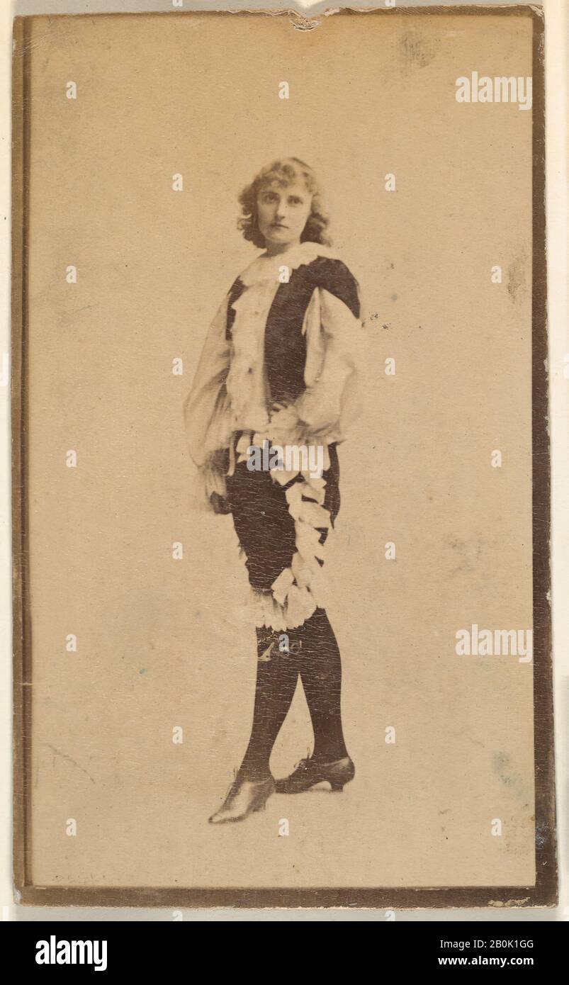 Actress wearing costume with ruffled blouse and trousers, from the Actresses series (N668), ca. 1888, Albumen photograph, Sheet: 3 3/4 × 2 1/16 in. (9.5 × 5.2 cm Stock Photo