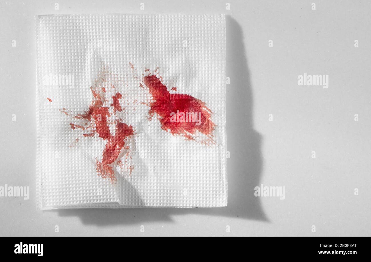 Kitchen paper napkin in the blood. Stopping blood by improvised means ...