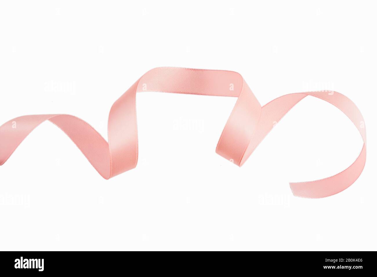 A Pink ribbon on a white background. Stock Photo