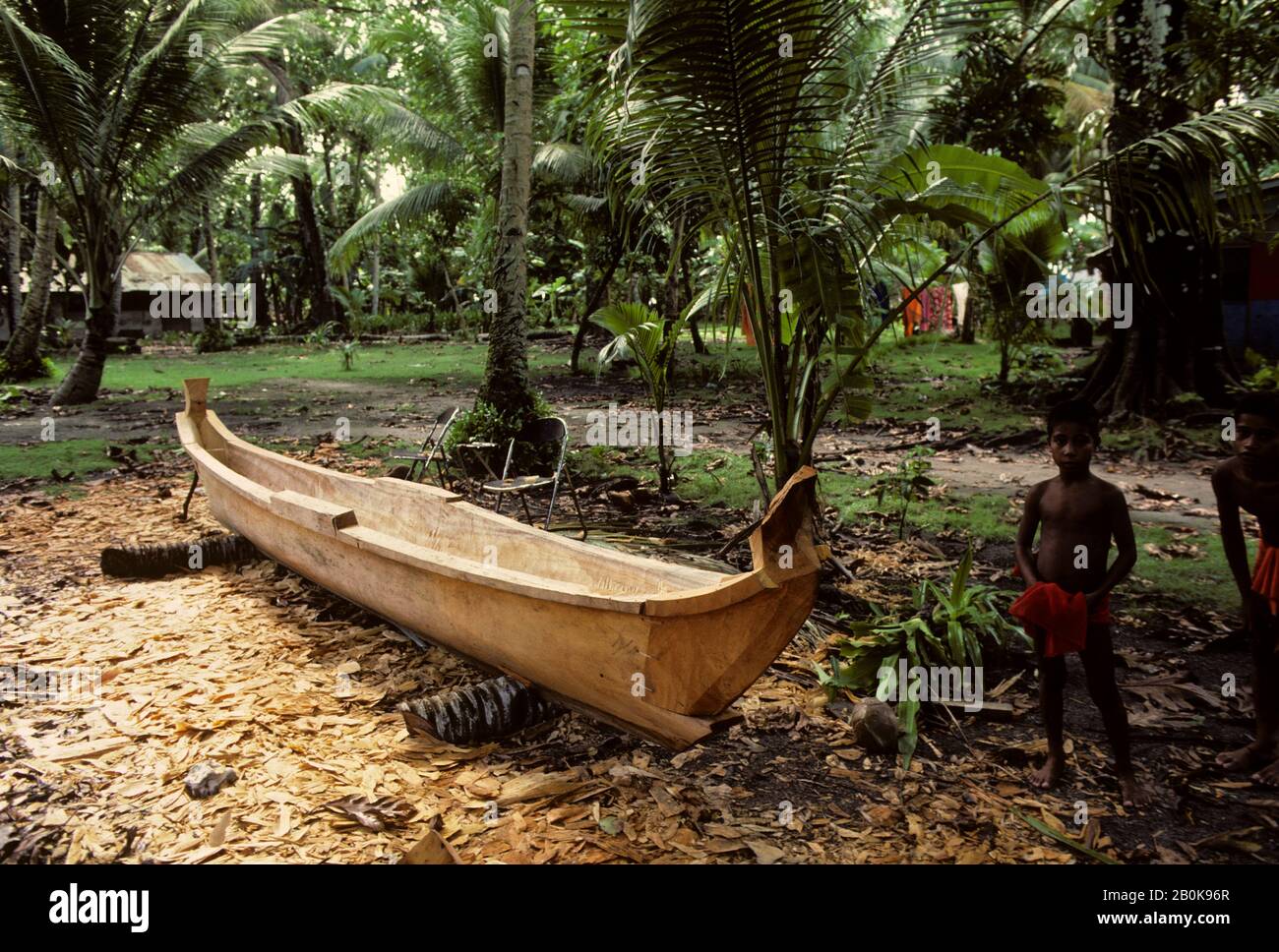 MICRONESIA, CAROLINE ISLS. PULAP ISLAND, DUGOUT CANOE BEING BUILT Stock