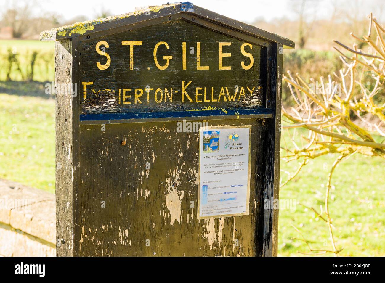 A sparsely populated notice board giving details of clergy and times of worship at the church of St Giles in Kellaways near Chippenham Wiltshire Engla Stock Photo