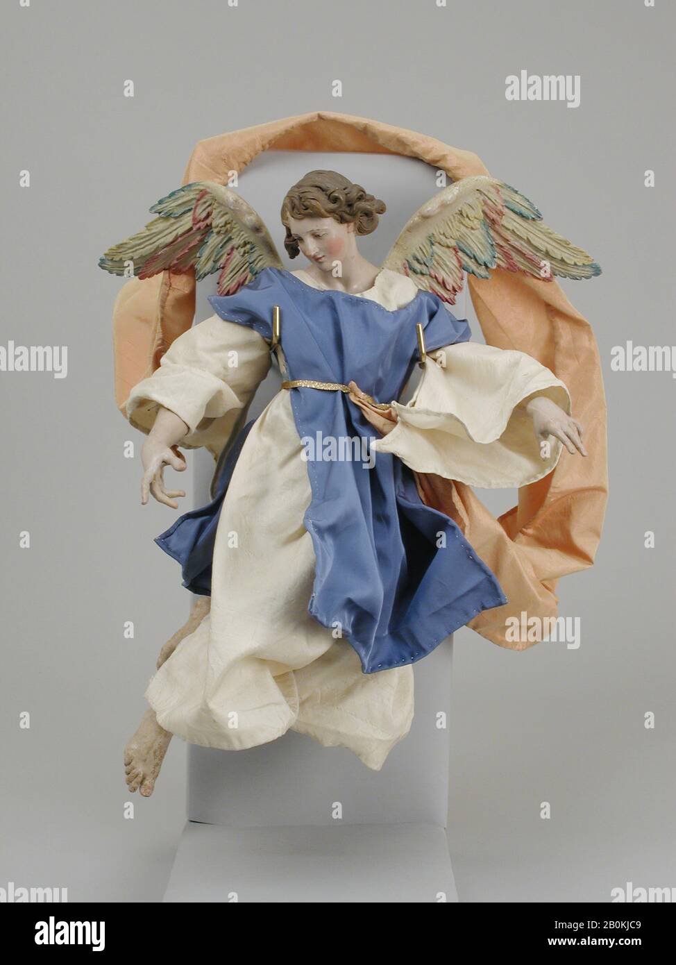Angel, Italian, Naples, late 18th–early 19th century, Italian, Naples, Polychromed terracotta head; wooden limbs and wings; body of wire wrapped in tow; silk garments, H. 14 1/2 in. (36.8 cm.), Crèche Stock Photo