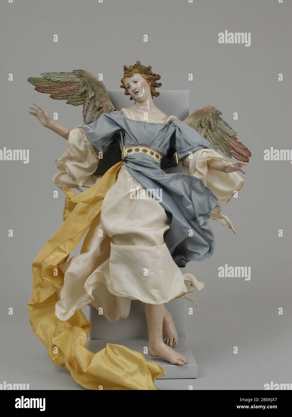 Angel, Italian, Naples, late 18th–early 19th century, Italian, Naples, Polychromed wood and terracotta; silk robes, H. 17 3/8 in. (44.1 cm.), Crèche Stock Photo