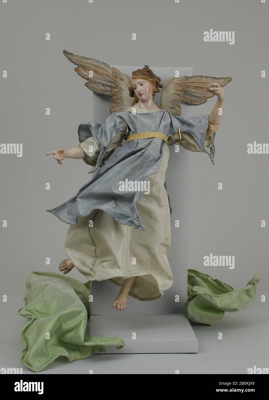 Angel, Italian, Naples, late 18th–early 19th century, Italian, Naples, Polychromed wood and terracotta, straw, cloth and silk, H. 13 3/4 in. (34.9 cm.), Crèche Stock Photo