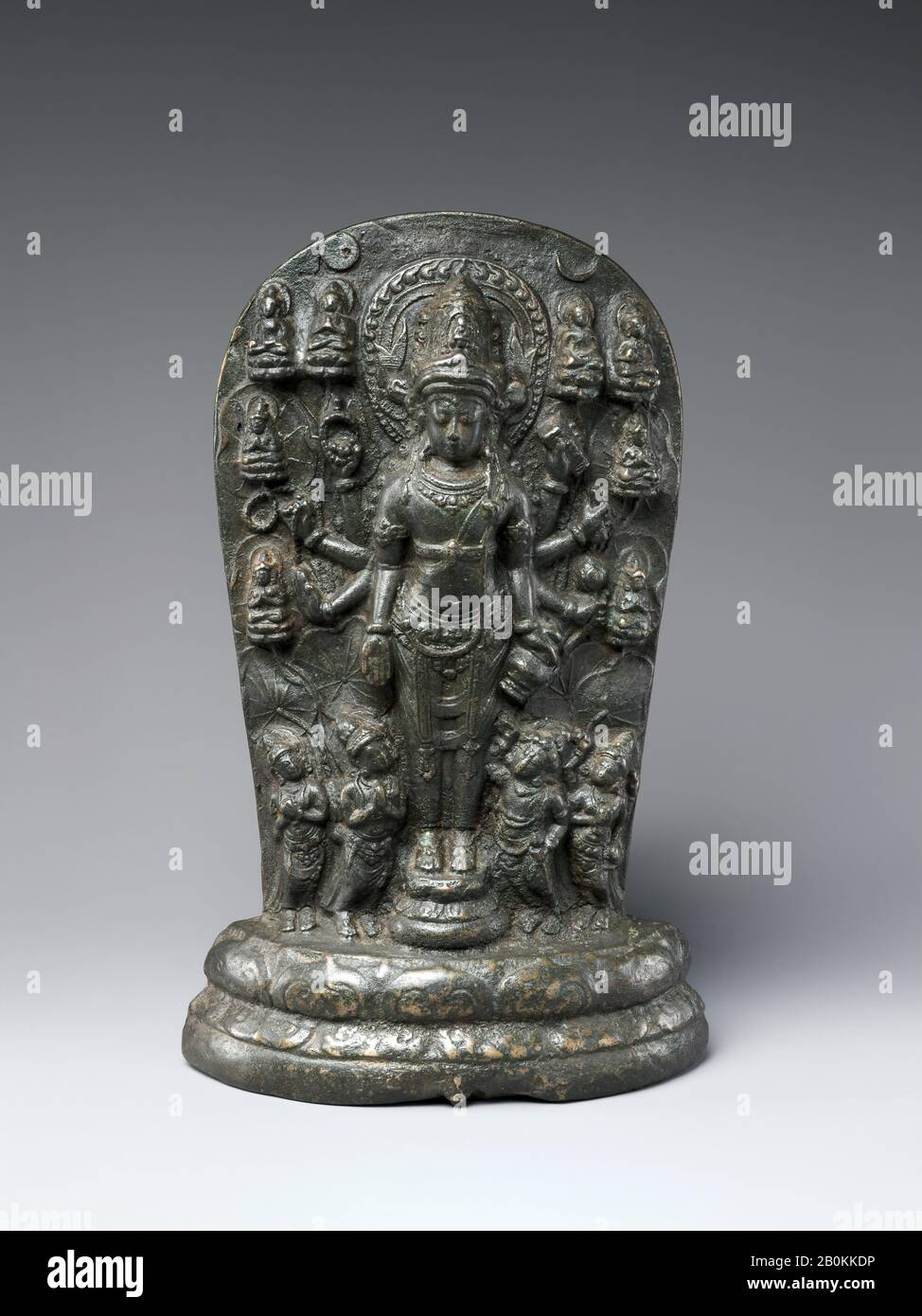 Candi Jago Plaque of the Bodhisattva Amoghapasa, Indonesia (East Java), Singasari kingdom, Date late 13th century, probably 1286–92, Indonesia (East Java), Copper alloy, H. 8 3/4 in. (22.2 cm); W. 5 1/2 in. (14 cm); D. 1 5/8 in. (4.1 cm); Wt. (with block) 7.5 lbs (3.4 kg), Sculpture Stock Photo