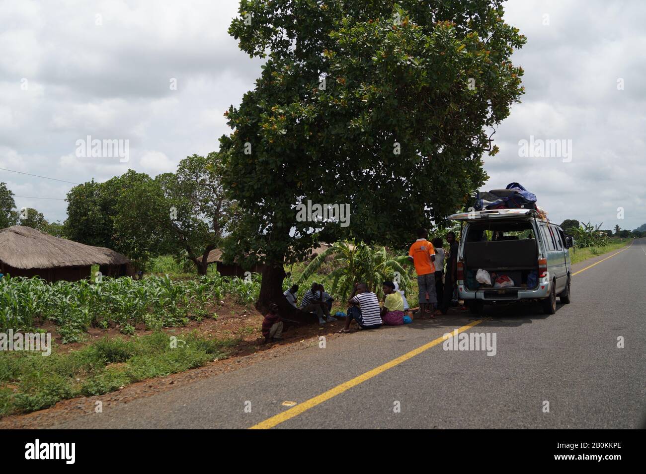 Broken car on mozambican road Stock Photo