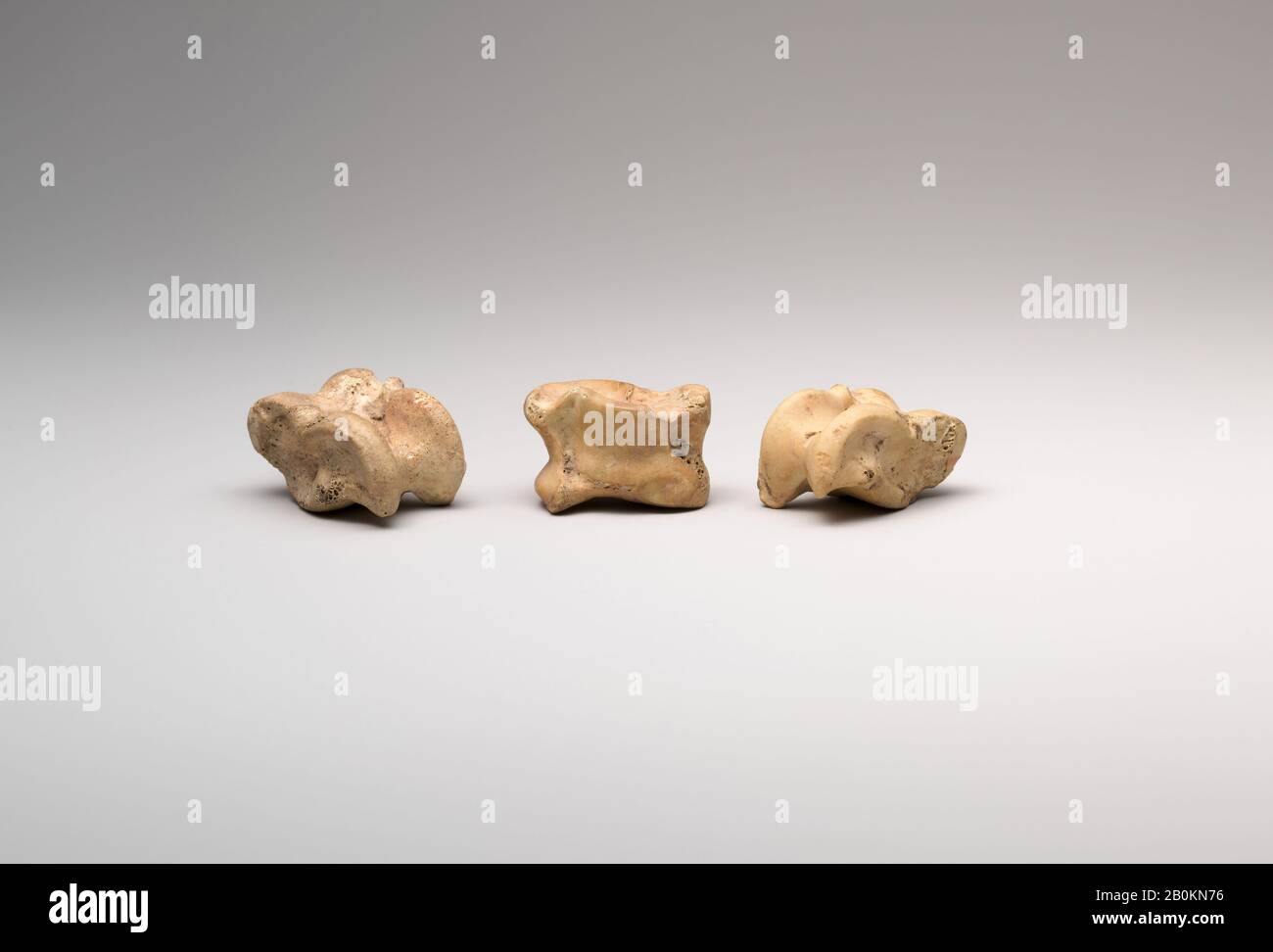 Three Knuckle bone Gaming Pieces, New Kingdom, Dynasty 18, early, ca. 1550–1458 B.C., From Egypt, Upper Egypt, Thebes, Asasif, Courtyard CC 41, Pit 1, Chamber B, 1915–16, Bone, a: L. 2.9 cm (1 1/8 in); w 2.1 cm (13/16 cm) ; b: L. 2.7 cm (1 1/16 in); w 1.8 cm (11/16 in); c: L. 2.5 cm (1 in); w 1.6 cm (5/8 in Stock Photo