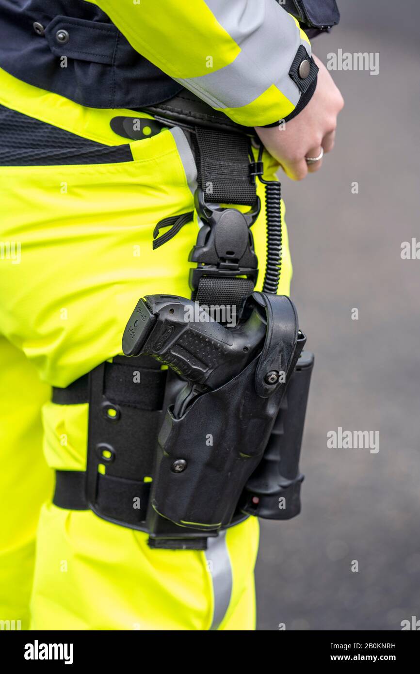 Police, policeman, weapon in thigh holster, uniform of the highway patrol NRW, Stock Photo