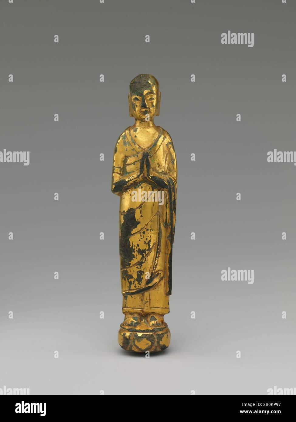 Monk, China, Northern Qi (550–77) or Sui (581–617) dynasty, Date mid- to late 6th century, China, Gilt leaded bronze, piece-mold cast, H. (with tang) 4 5/8 in. (11.7 cm); W. 1 in. (2.6 cm); Diam. 1/4 in. (.6 cm), Sculpture Stock Photo