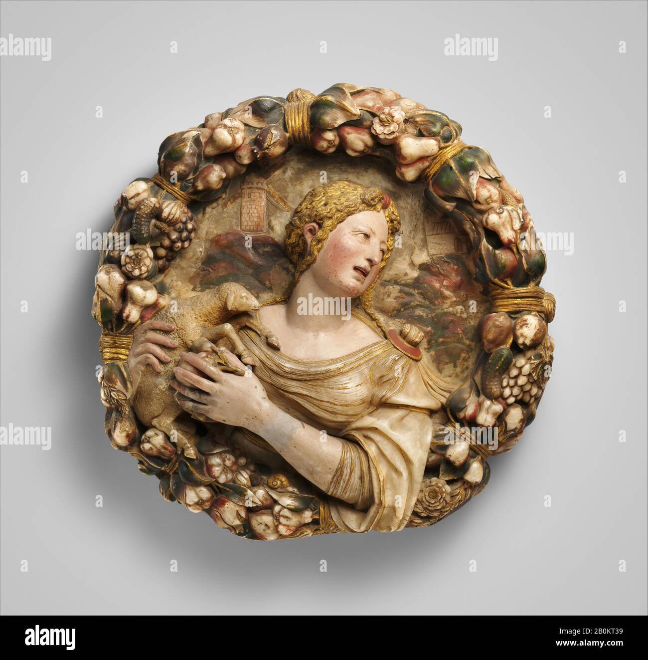 Possibly by Diego de Tiedra, Saint Agnes (one of a pair), Spanish, possibly Aragon, Possibly by Diego de Tiedra (Spanish, died 1559), mid-16th century, Spanish, possibly Aragon, Alabaster, painted and gilt, Overall: H. 20 1/4 x W. 20 1/2 x D. 4 7/8 in. (51.4 x 52.1 x 12.4 cm), Diameter (historic dimensions, superceded): 21 in. (53.3 cm), Sculpture Stock Photo