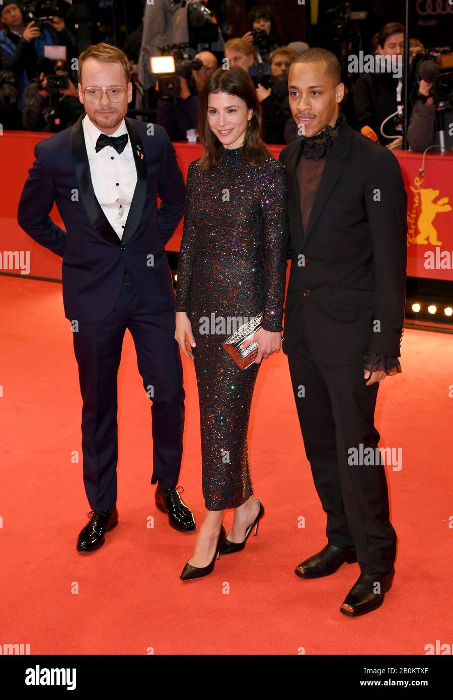 Berlin, Germany. 20th Feb, 2020. 70th Berlinale, opening gala: Actor Jerry Hoffmann (r), actress Aylin Tezel (M) and actor Stefan Konarske (l) at the opening ceremony of the International Film Festival. The Berlinale opens with the film 'My Salinger Year'. Credit: Jörg Carstensen/dpa/Alamy Live News Stock Photo