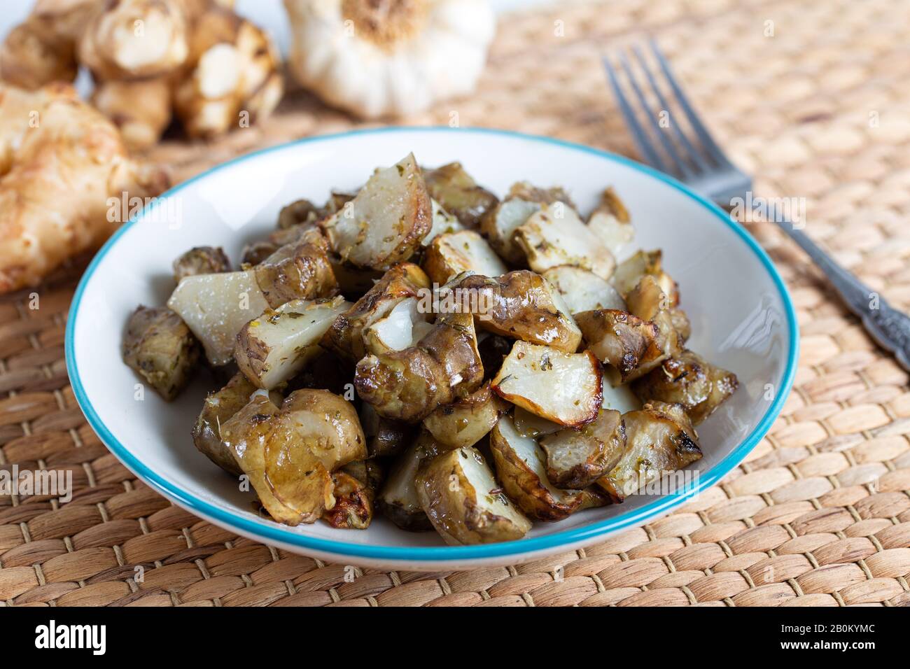 Spicy fried Jerusalem artichoke with garlic Stock Photo Alamy
