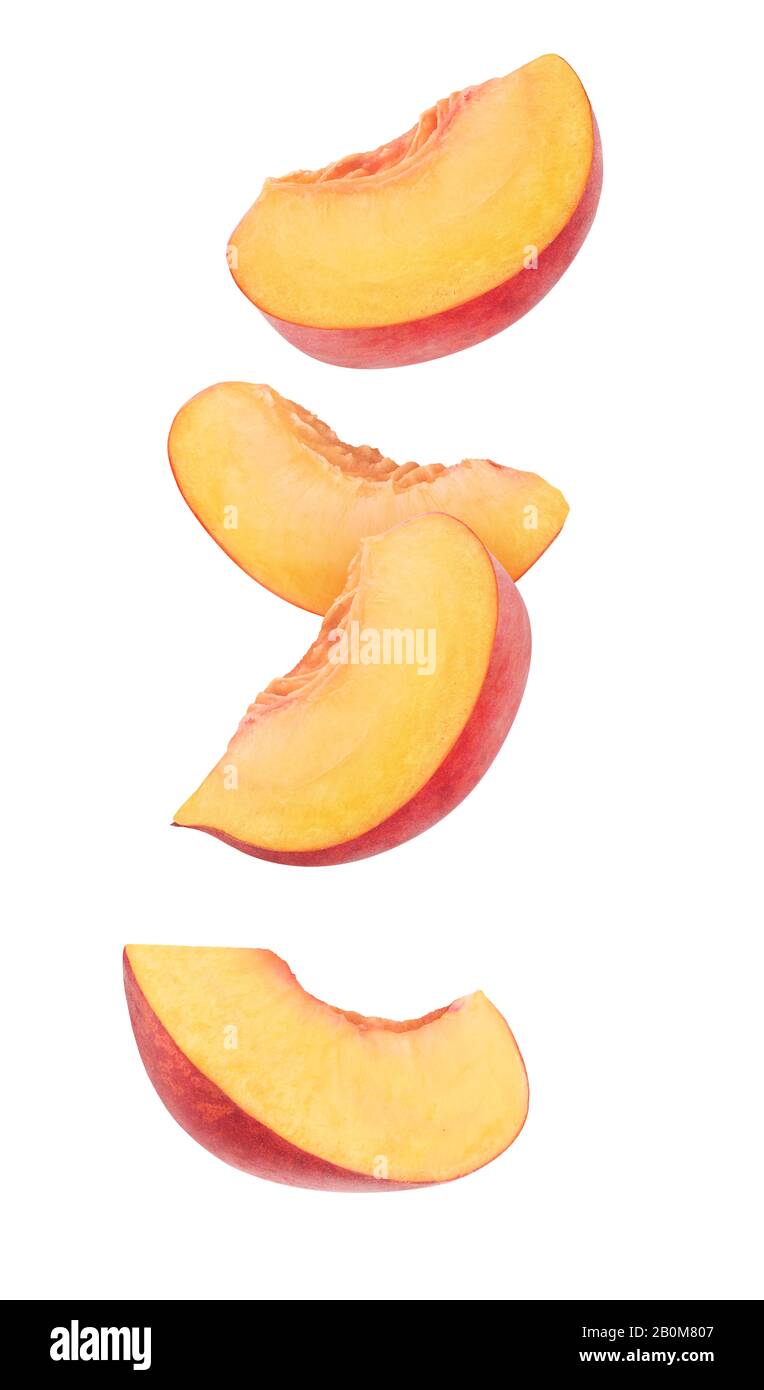 Isolated peach slices. Four wedges of raw peach fruits isolated on