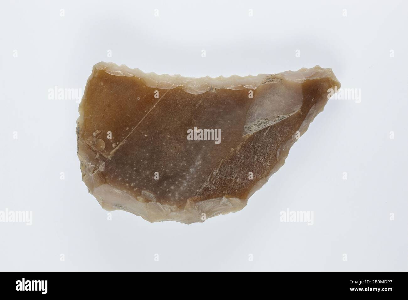 Sickle Insert, New Kingdom, Ramesside, Dynasty 19–20, ca. 1186–1070 B.C., From Egypt, Memphite Region, Lisht North, Cemetery, 1908–10, Flint, adhesive (lime plaster ?), L. 7.4 × W. 4.2 × Th. 1.5 cm, Wt. 42.6g (2 15/16 × 1 11/16 × 9/16 in., 1.503oz Stock Photo