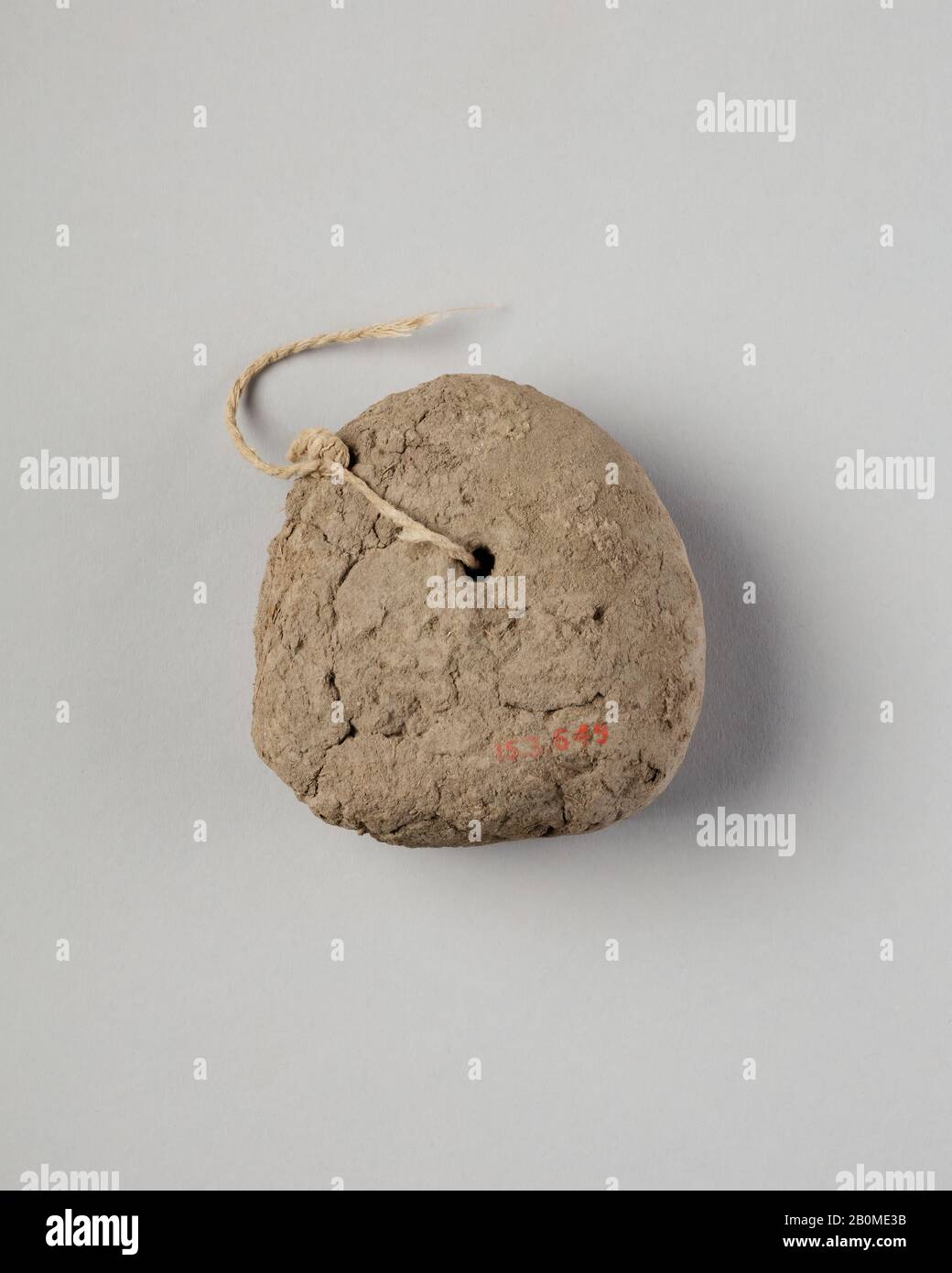 Loom Weight (?), New Kingdom, Ramesside, Dynasty 19–20, ca. 1295–1070 B.C., From Egypt, Memphite Region, Lisht North, Cemetery, 1913–14, Mud, string, H. 8 × W. 8 cm (3 1/8 × 3 1/8 in Stock Photo