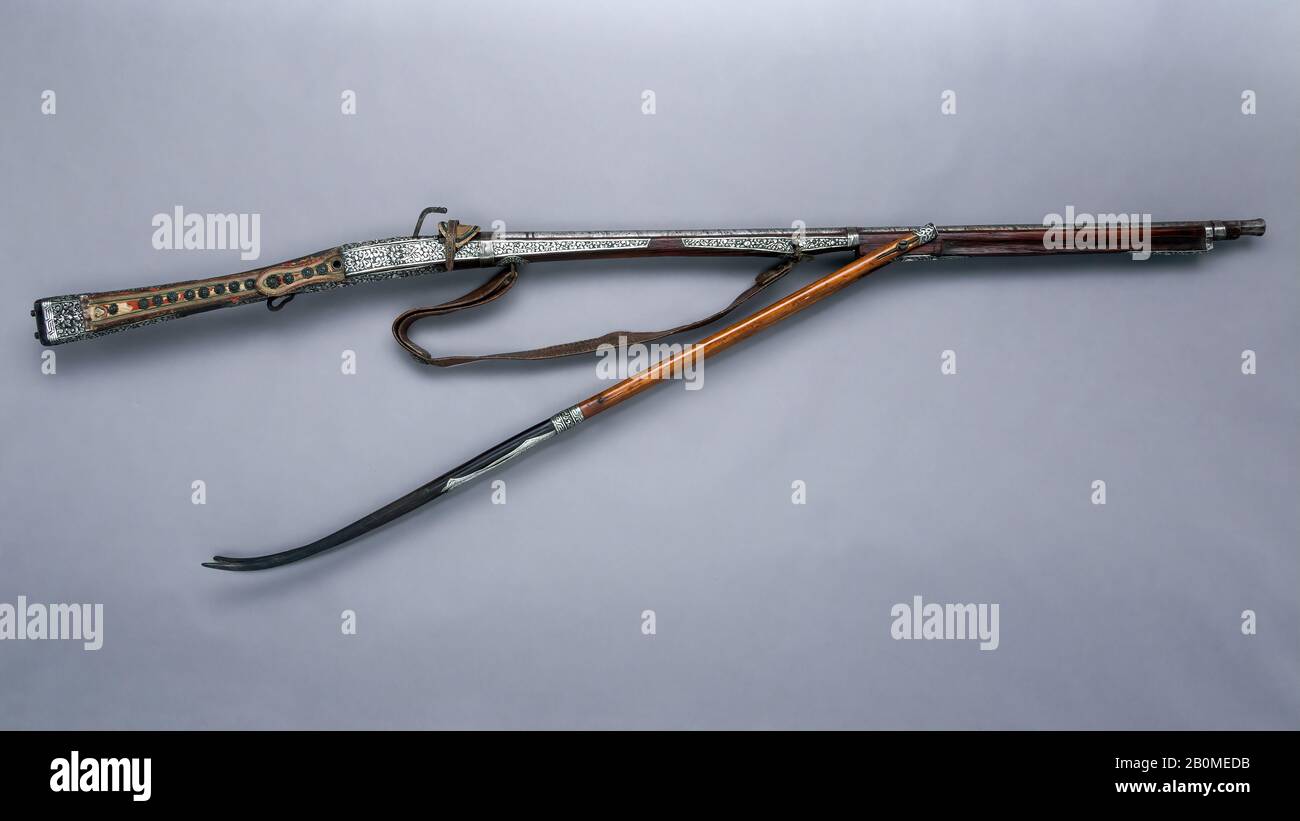 Matchlock Musket (me mda'), Tibetan, barrel, probably 18th–19th century; stock and other fittings, probably mid-19th–early 20th century, Tibetan, Iron, silver, wood, horn, leather, textile, L. 64 1/8 in. (162.9 cm); L. of barrel 42 3/8 in. (107.6 cm); Cal. 0.56 in. (14.2 mm), Firearms-Guns-Matchlock Stock Photo