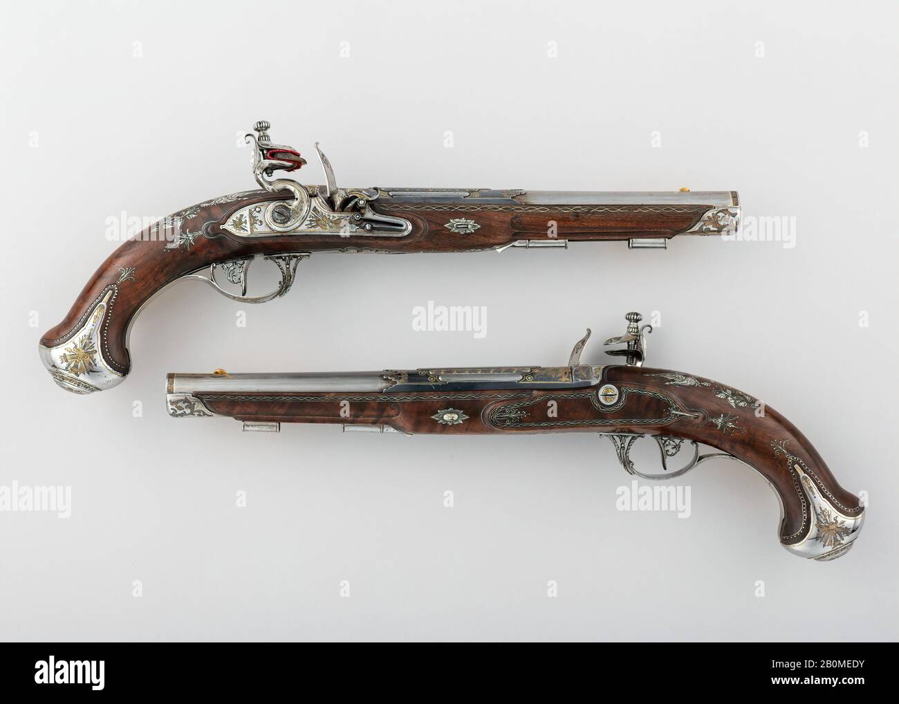 Tula Arms Factory, Pair of Flintlock Pistols made for Grand Duke Constantine Pavlovich of Russia (1779–1831), Russian, Tula, Tula Arms Factory (Russian, Tula, 1712–Present), ca. 1801, Tula, Russian, Tula, Steel, silver, gold, wood, L. of each pistol 15 ¼ in. (38.8 cm); L. of each barrel 9 3/16 in. (23.3 cm); Cal. of each barrel 9/16 in. (15 mm); Wt. of pistol (a) 1 lb. 13 oz. (821 g); Wt. of pistol (b) 1 lb. 14 oz. (845 g), Firearms-Pistols-Flintlock Stock Photo