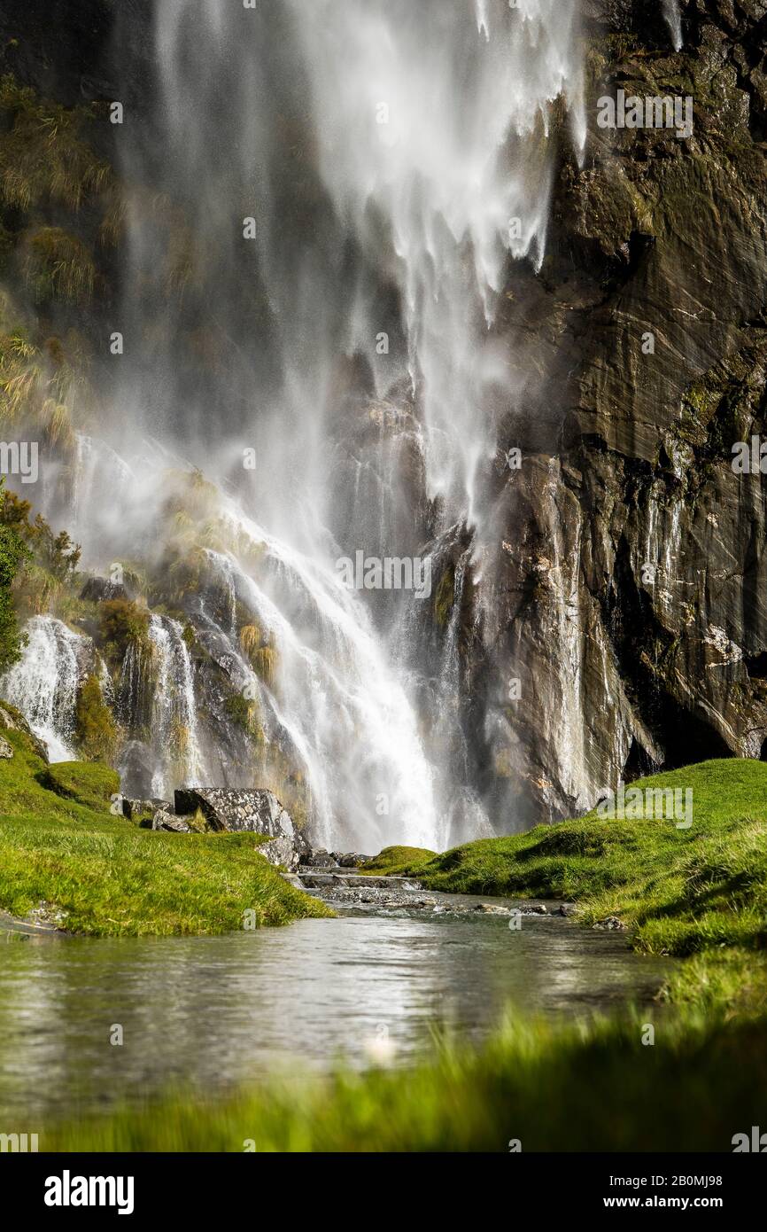 Waterfall cascading in lush green hi-res stock photography and images ...