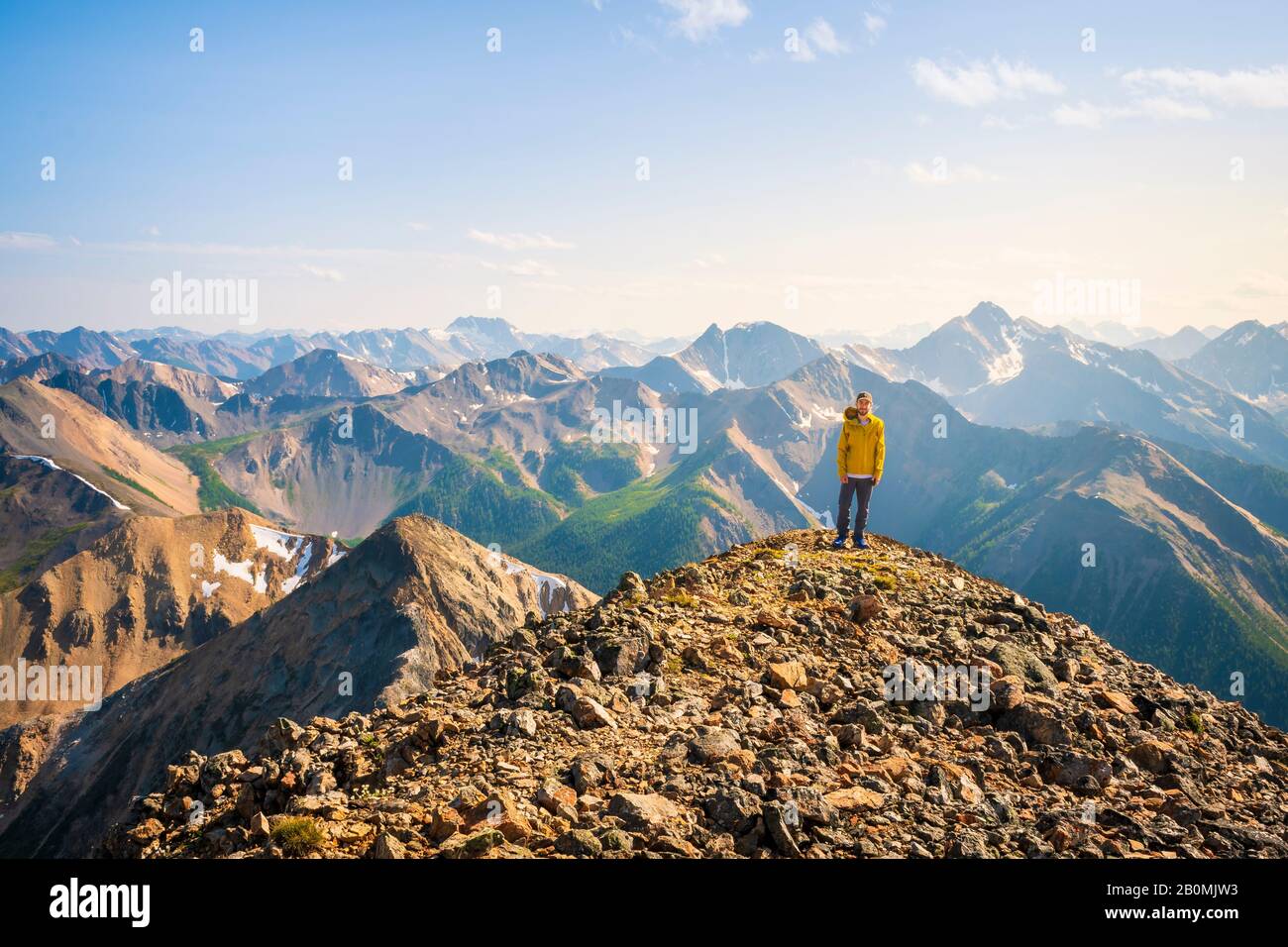 Back view hiker in yellow hi-res stock photography and images - Alamy