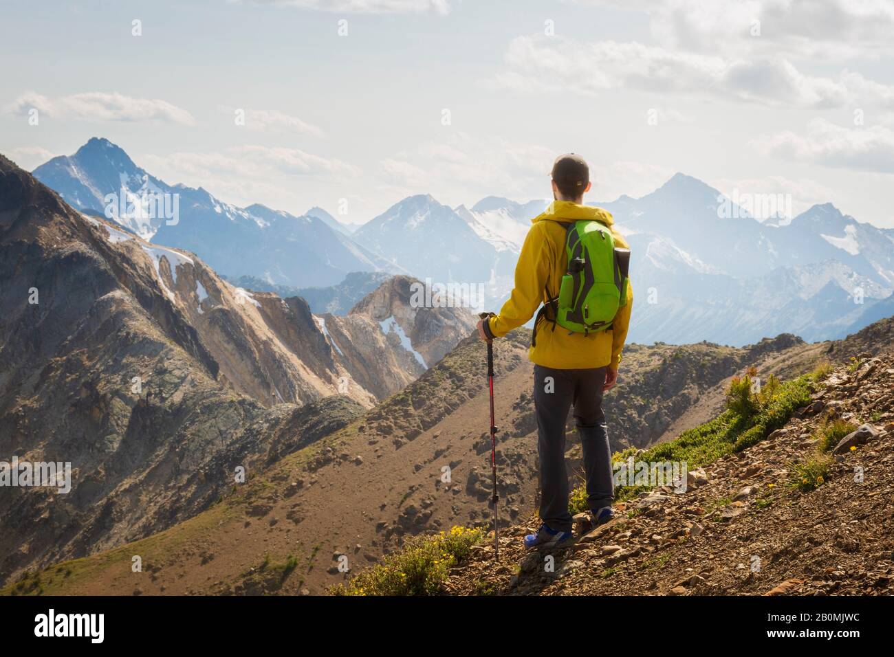 Back view hiker in yellow hi-res stock photography and images - Alamy