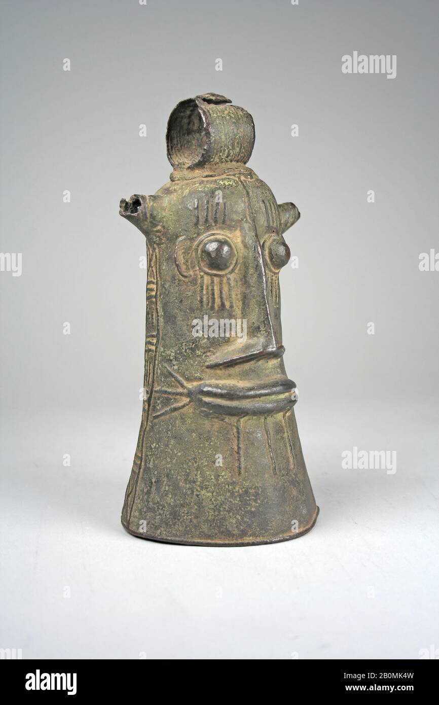 Bell: Face, Lower Niger Bronze Industry, 15th–19th century, Nigeria, Lower Niger River region, Lower Niger Bronze Industry, Bronze, H. 7 7/8 x W. 4 x D. 3 11/16 in. (20 x 10.2 x 9.4 cm), Metal-Musical Instruments Stock Photo