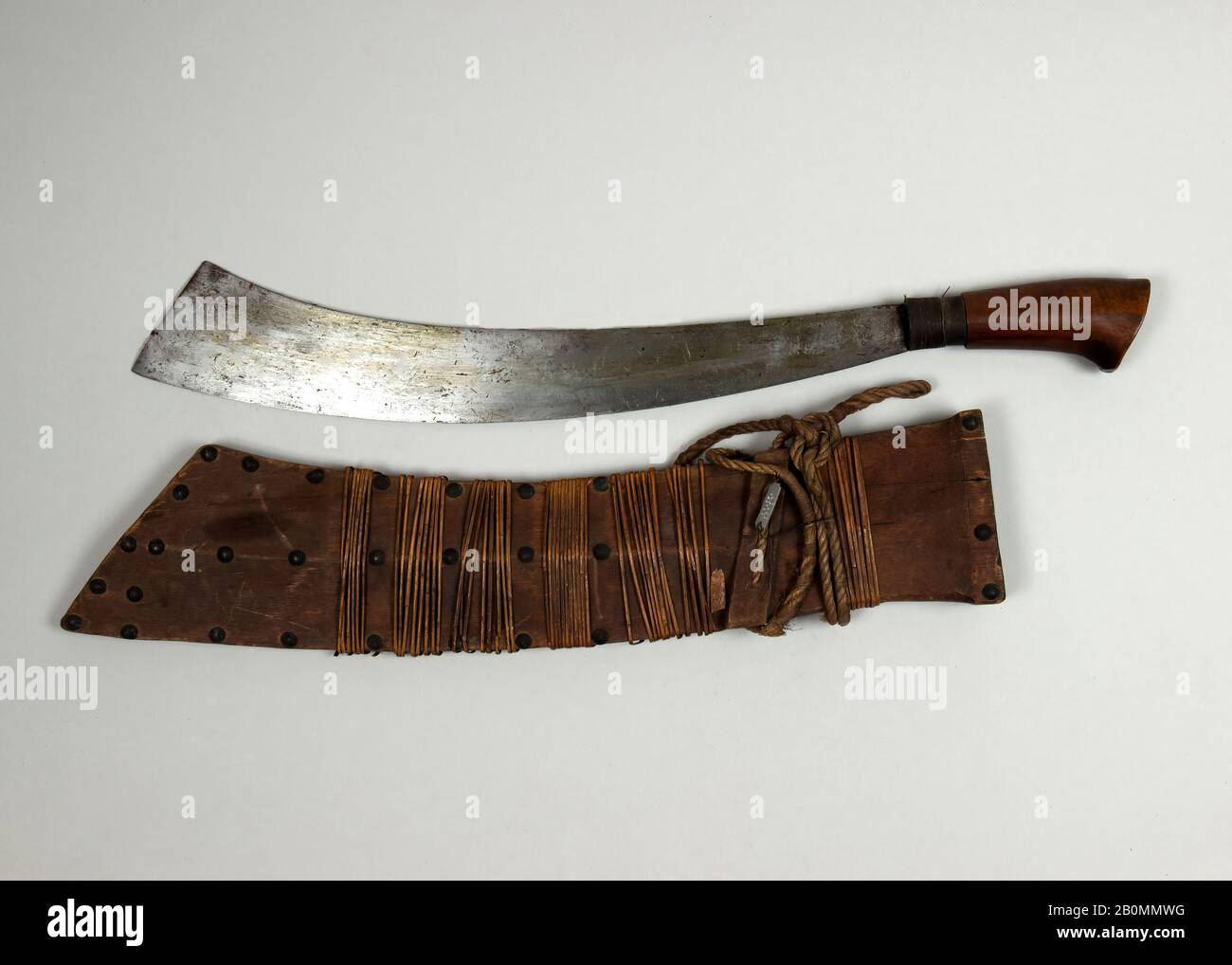 Jungle Knife with Sheath, Philippine, Yakan, 18th–19th century, Basilan, Philippine, Yakan, Steel, wood, brass, cane (rattan), L. with sheath 25 1/2 in. (64.8 cm); L. without sheath 22 1/4 in. (56.5 cm); L. of blade 17 1/8 in. (43.5 cm); W. 2 in. (5.1 cm); Wt. 1 lb. 13.6 oz. (839.1 g); Wt. of sheath 10.9 oz. (309 g), Knives Stock Photo
