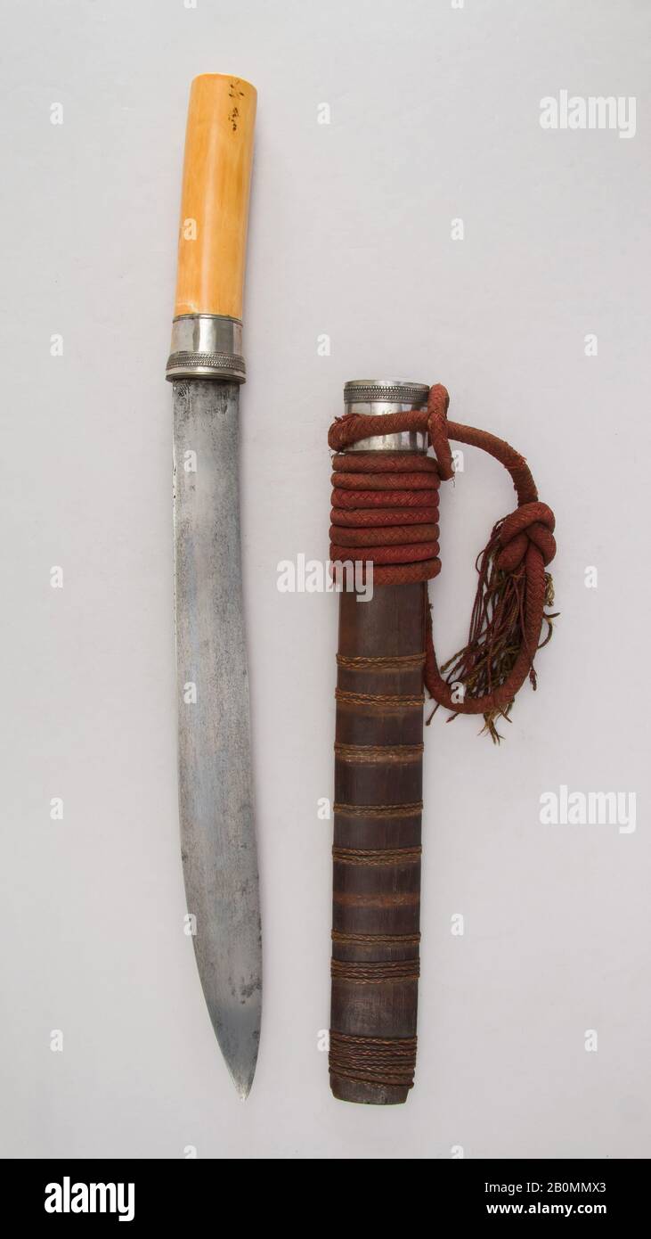 Sword (Dha) with Scabbard and Baldric, Burmese, 19th century, Burmese, Ivory, silver, wood, H. with sheath 23 7/8 in. (60.6 cm); H. without sheath 23 3/4 in. (60.3 cm); W. 1 9/16 in. (4 cm); Wt. 1 lb. 11.1 oz. (768.3 g); Wt. of sheath 7.9 oz. (224 g), Swords Stock Photo