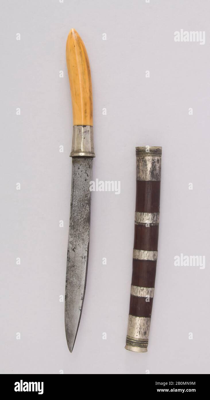 Knife (Dha) with sheath, Burmese, 19th century, Burmese, Wood, ivory, silver, steel, H. with sheath 14 5/16 in. (36.4 cm); H. without sheath 13 13/16 in. (35.1 cm); W. 1 in. (2.5 cm); Wt. 6 oz. (170.1 g); Wt. of sheath 2.5 oz. (70.9 g), Knives Stock Photo