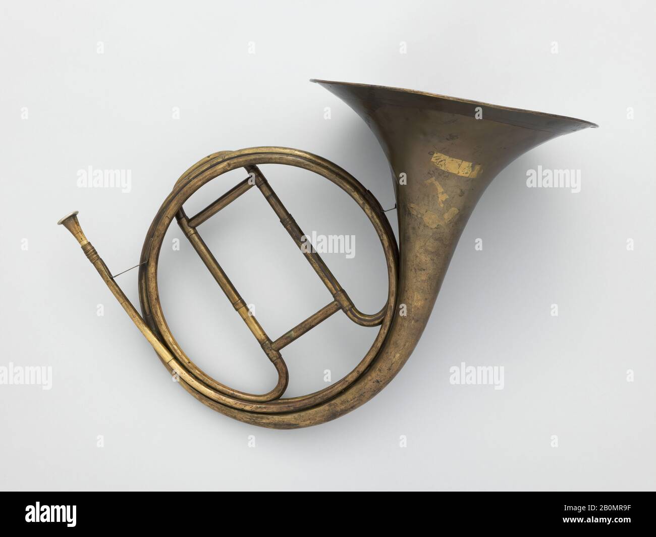 Unknown, Orchestral Horn, German, Unknown, for sale by Carl Gottfried Glier and Sons, ca. 1830, Markneukirchen or vicinity, Germany, German, brass, 17 × 22 1/2 × 11 1/8 in. (43.2 × 57.2 × 28.3 cm), Aerophone-Lip Vibrated-horn Stock Photo