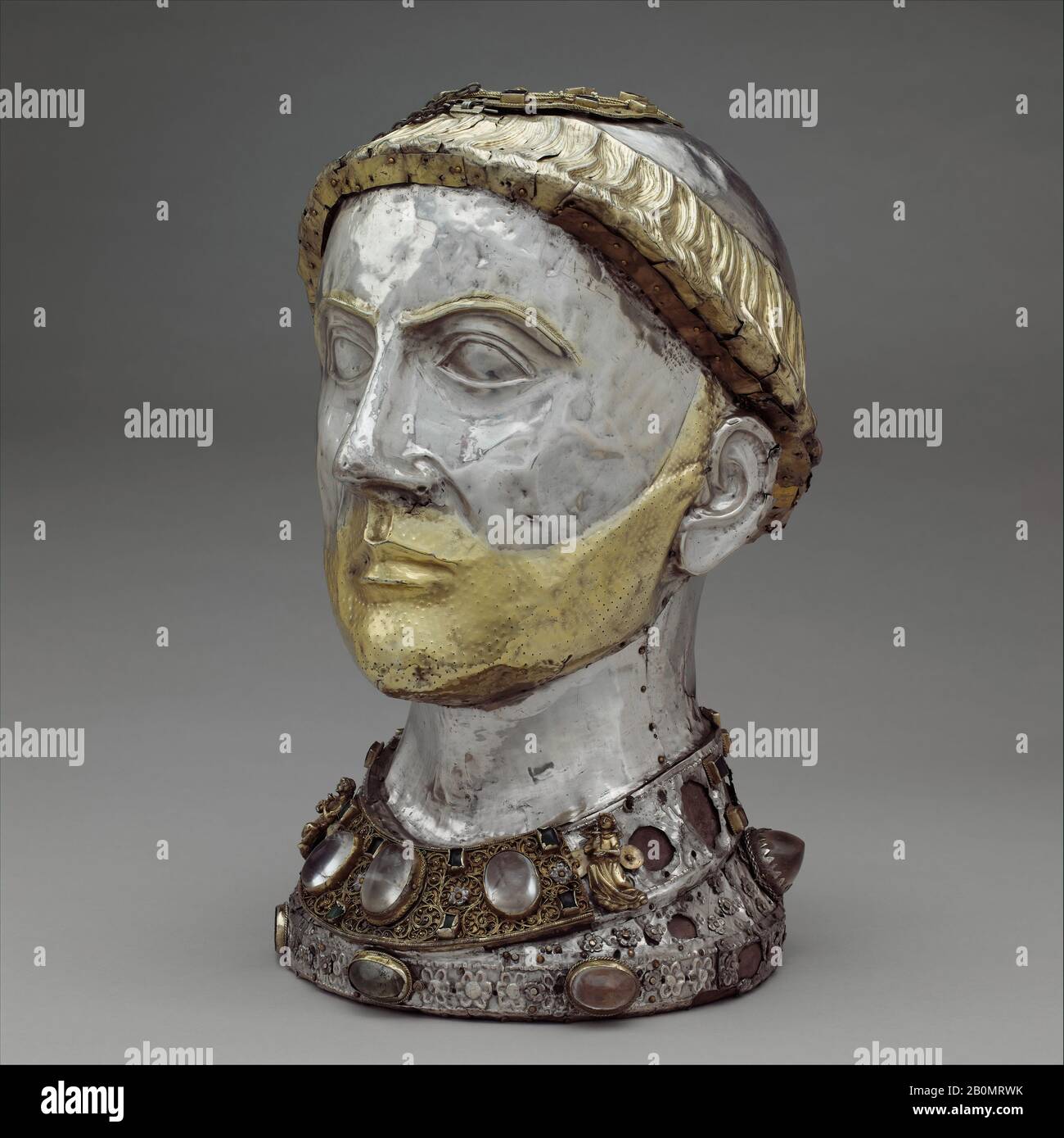 Reliquary Bust of Saint Yrieix, French, ca. 1220–40, with later grill, Made in Limoges, France, French, Silver and gilded silver with rock crystal, gems, and glass, Overall (Reliquary): 15 x 9 3/16 x 10 1/4 in. (38.1 x 23.4 x 26.1 cm), Other (Wooden core): 14 7/16 x 8 7/8 x 9 13/16 in. (36.6 x 22.5 x 24.9 cm), Metalwork-Silver Stock Photo