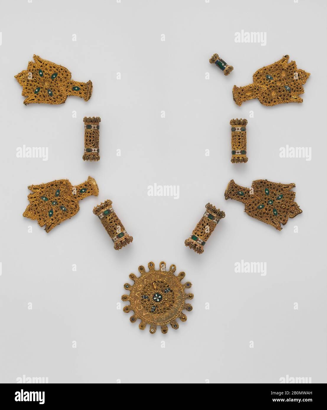 Elements from a Necklace, Spanish, late 15th–16th century, Made in Granada, Spain, Spanish, Gold, cloisonnè enamel, f:wheel shaped medallion: 3 x 3/16 in. (7.6 x 0.5 cm), b,d,j,h:4 lotus bud plaques: 3 5/16 x 2 1/16 x 3/16 in. (8.4 x 5.2 x 0.5 cm), e,g:largest cylindrical beads: 2 x 3/4 in. (5.1 x 1.9 cm), c,i:cylindrical beads: 1 7/8 x 11/16 in. (4.8 x 1.7 cm), a:smallest cylindrical bead: 1 x 1/2 in. (2.5 x 1.3 cm), Metalwork-Gold Stock Photo
