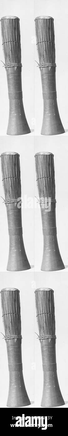 Gendang, Bornean, late 19th century, Borneo, Bornean, Wood, snakeskin, rattan, L. 77.5 cm (30-1/2 in.), Diam. of head 14 cm (5-1/2 in.), Opp. end 17.8 cm (7 in.) (in pencil) 'L.C. says, 'H. 34 in., D. at base 7 in.'', Membranophone-single-headed, goblet drum Stock Photo