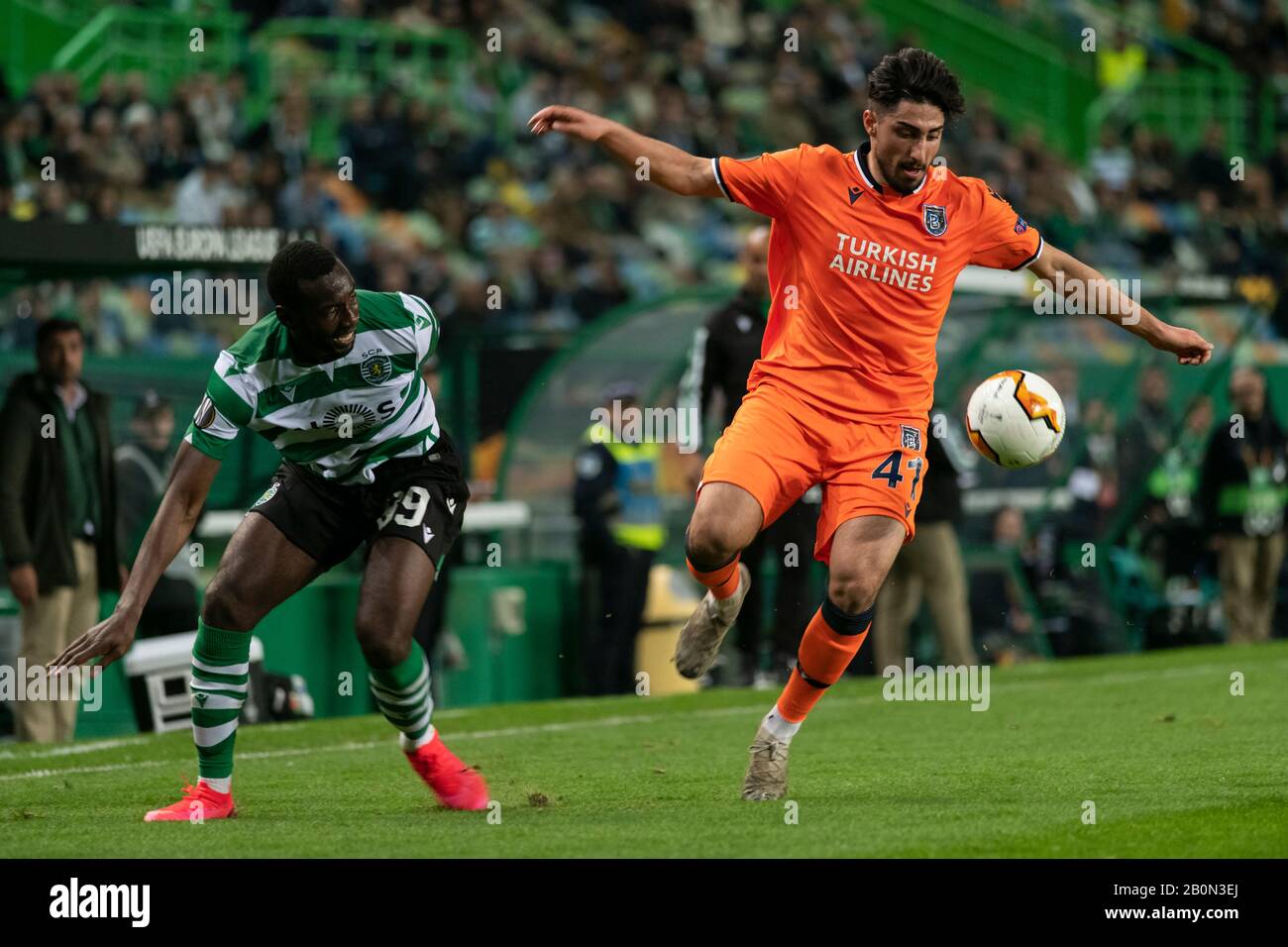 Istanbul Ba?ak?ehir FK player Berkay Ozcan (R) and Sporting CP Yannick Bolasie (L) are seen in action during the UEFA Europa League Match 2019/20, Sporting CP vs Istanbul Ba?ak?ehir FK at José Alvalade Stadium.(Final Score: Sporting CP 3 -1 Istanbul Ba?ak?ehir FK) Stock Photo
