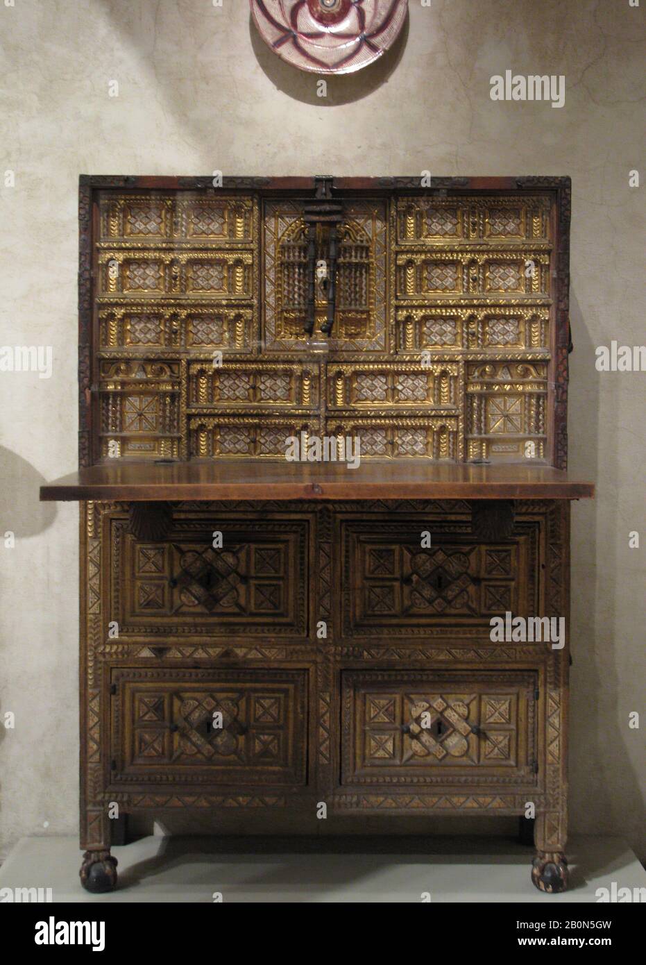 Drop-front desk on chest (Vargueño), Spanish, 17th century, Spanish, Carved, gilded, and partly gilded painted bone; wrought iron, Total H.: 63-3/8 in. (160 cm), a) 38 x 44 x 17 in. (96.5 x 111.8 x 43.2 cm), b) 27 x 43 x 16-3/8 in. (68.6 x 109.2 x 41.6 cm), Woodwork-Furniture Stock Photo