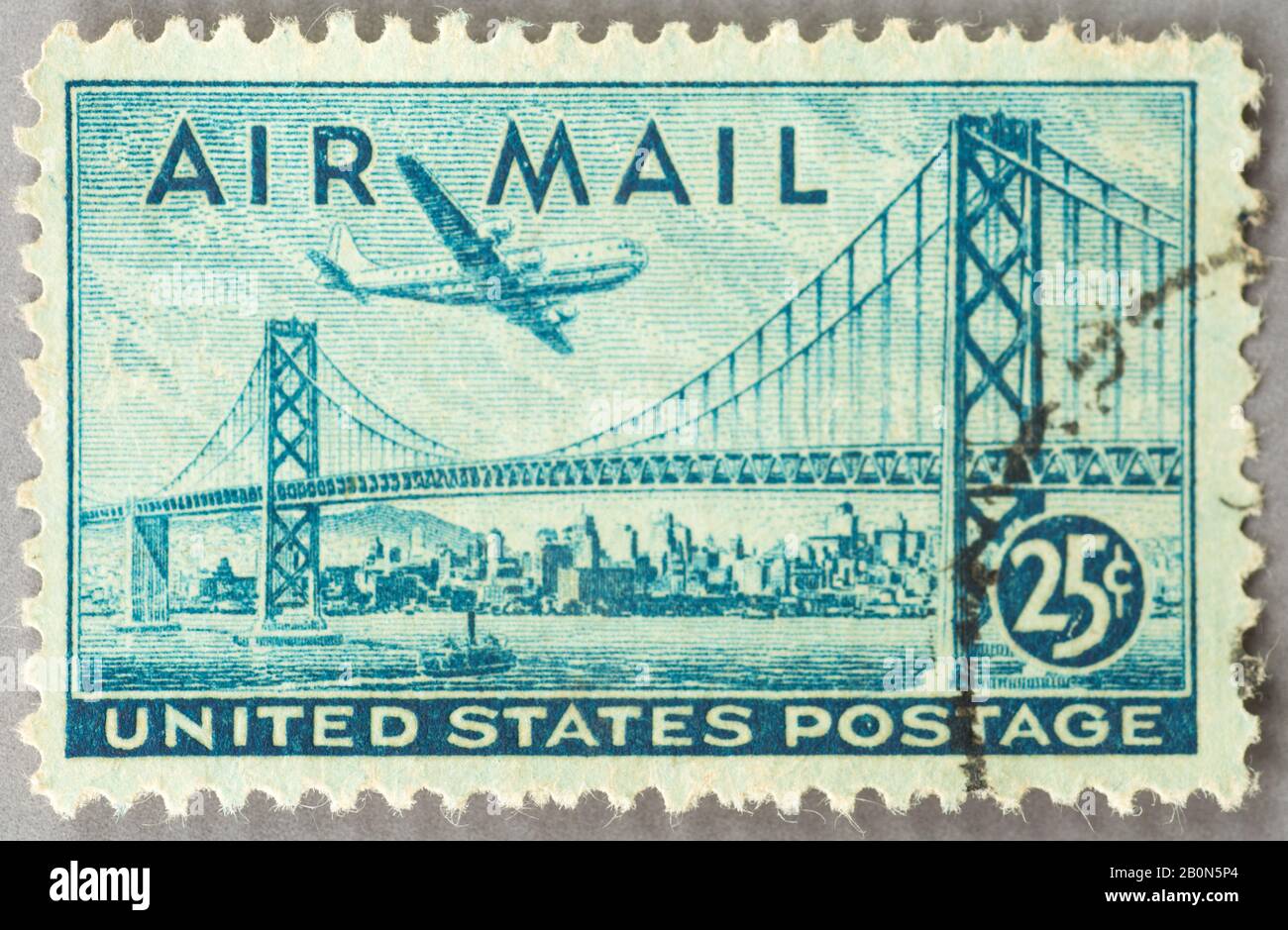 A 1947 US Airmail stamp from 1947 featuring the San Francisco-Oakland Bay Suspension Bridge. Stock Photo