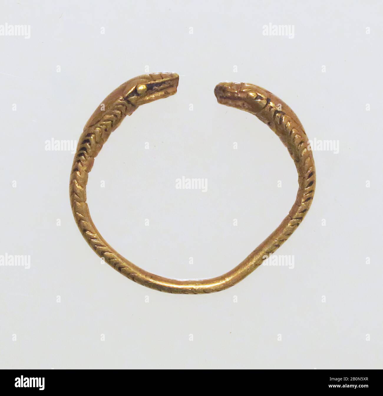 Ring, spiral with snake heads, Gold, Other: 11/16 × 3/4 × 3/16 in. (1.8 × 2 × 0.4 cm), Gold and Silver Stock Photo