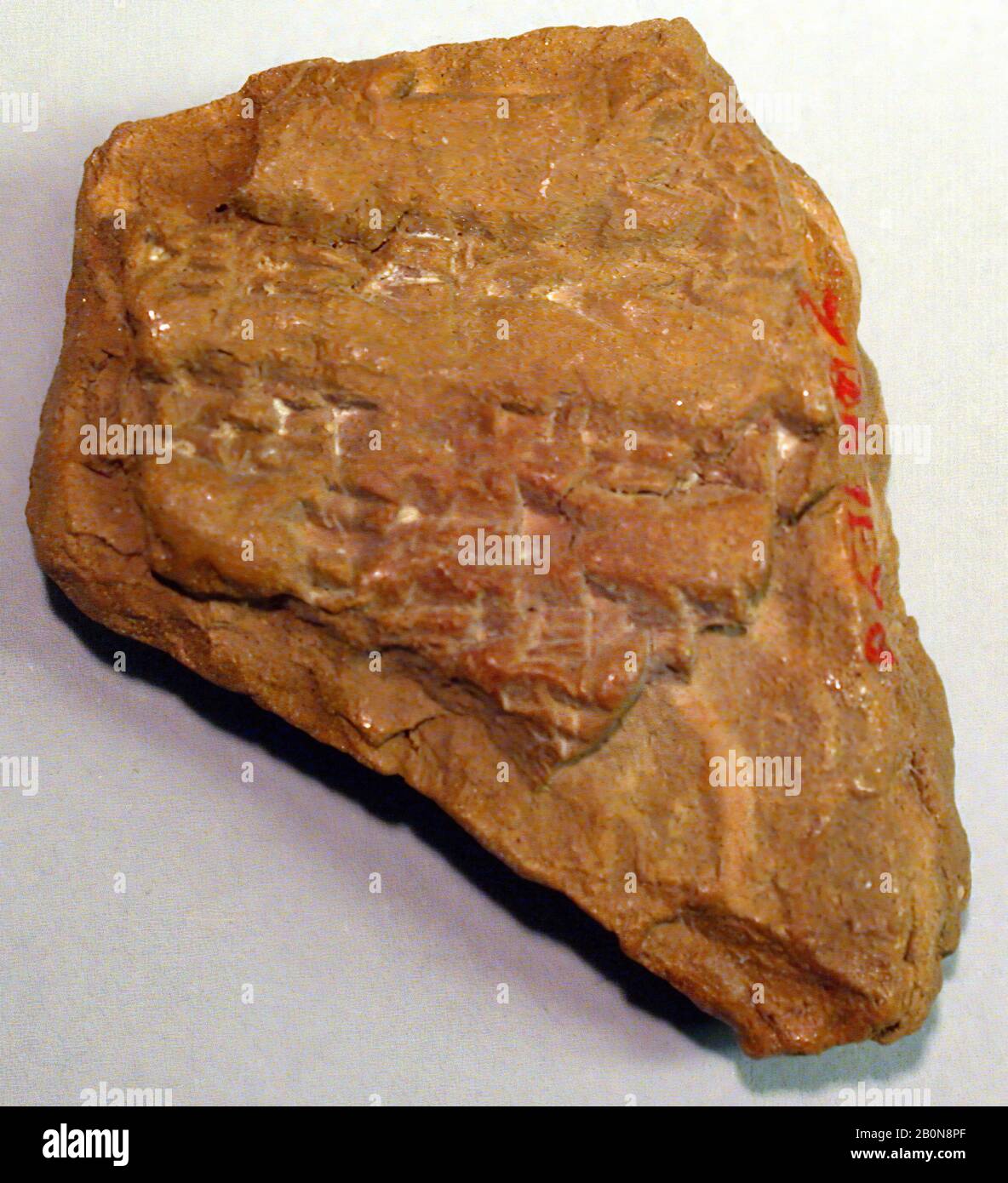 Cuneiform tablet: unidentified fragment, ca. late 1st millennium B.C., Mesopotamia, Clay, 1 5/8 x 1 1/4 x 5/8 in. (4 x 3.3 x 1.5 cm), Clay-Tablets-Inscribed Stock Photo