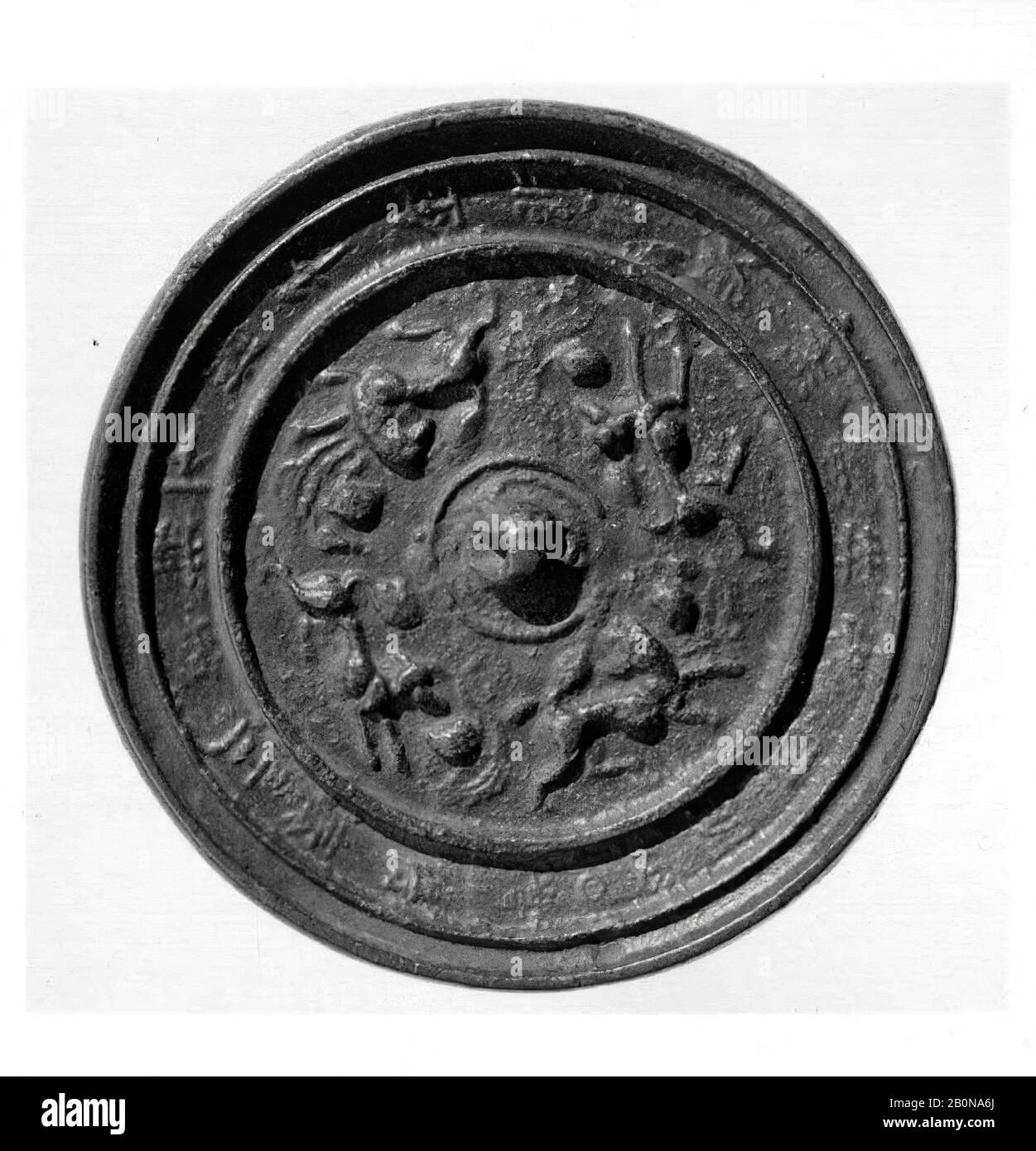 Mirror, China, Six Dynasties (220–589) style, Culture: China, Bronze, Diam. 5 3/4 in. (14.6 cm), Mirrors Stock Photo