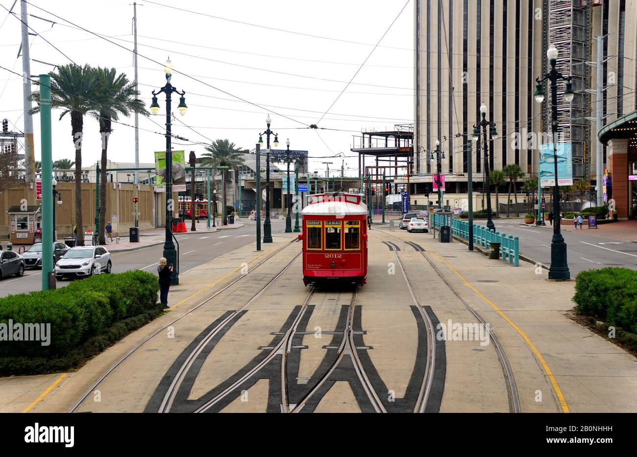 New Orleans, Louisiana, U.S.A - February 4, 2020 - The red streetcar and traffic on Canal Street Stock Photo