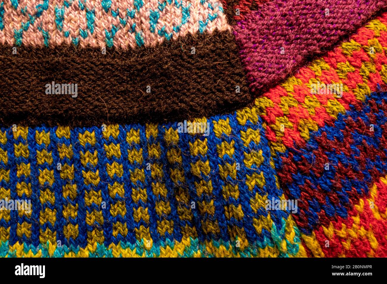 colorful knitted wool textured patchwork fabric background Stock Photo