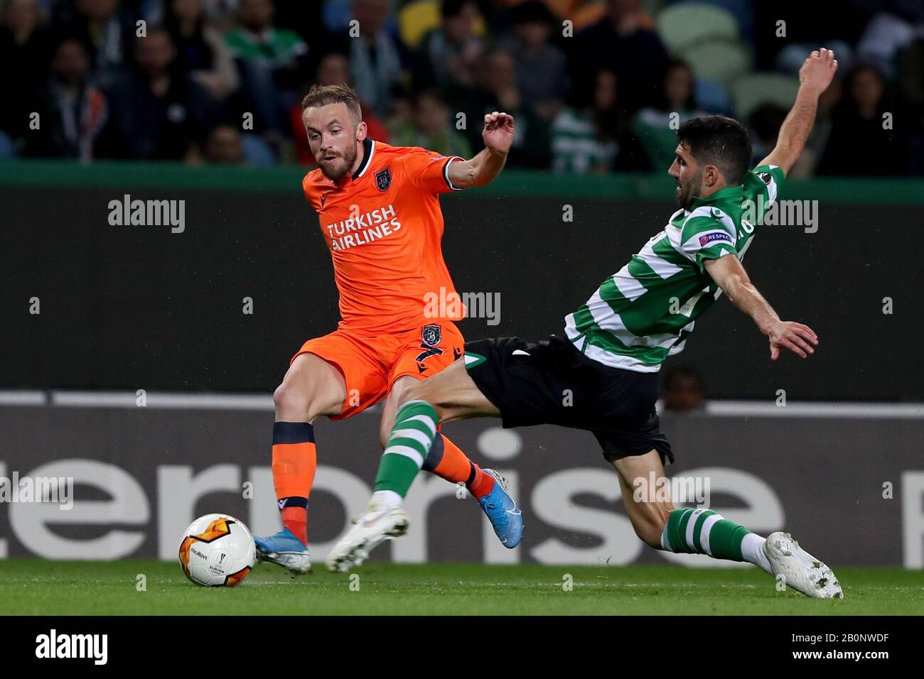 Lisbon, Portugal. 20th Feb, 2020. Edin Visca of Istanbul Basaksehir (L) vies with Luis Neto of Sporting CP during the UEFA Europa League round of 32 first leg football match between Sporting CP and Istanbul Basaksehir at Alvalade stadium in Lisbon, Portugal, on Feb. 20, 2020. Credit: Pedro Fiuza/Xinhua/Alamy Live News Stock Photo